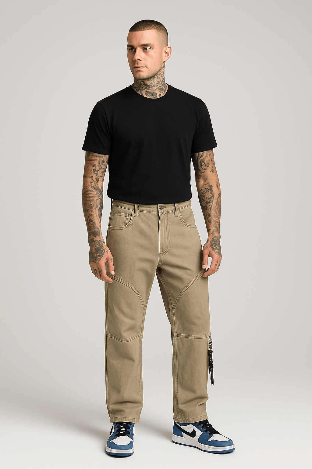 Man in black t-shirt and khaki pants.