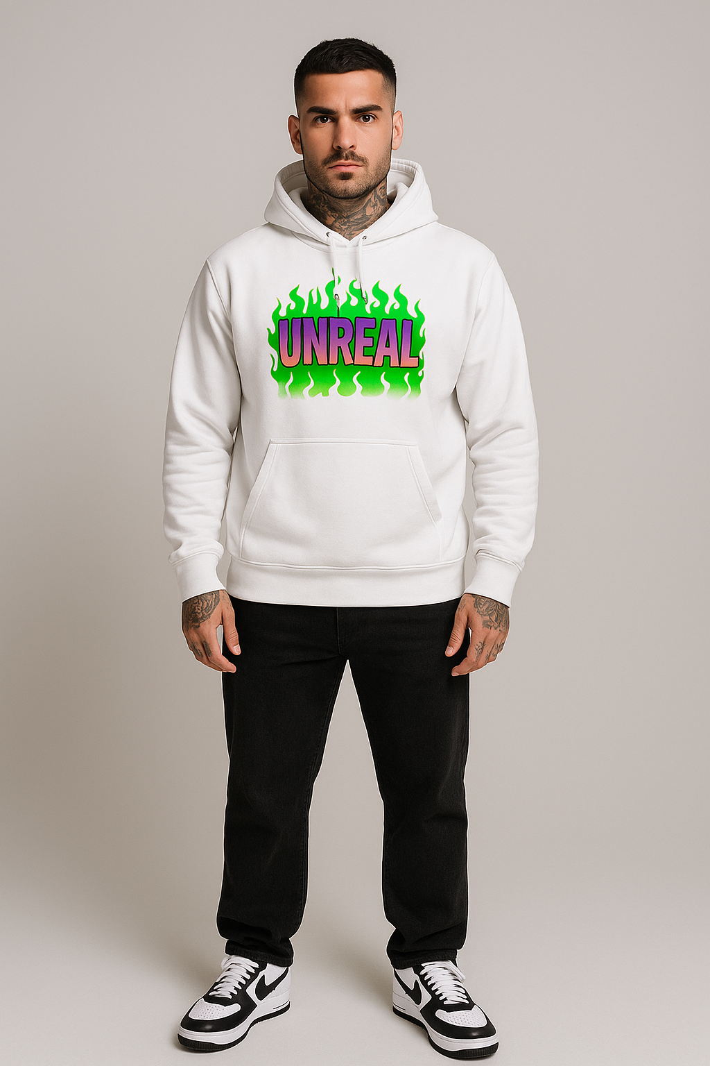 White hoodie with ’UNREAL’ graphic.