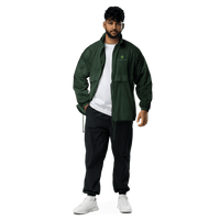 Man in green jacket and black pants wearing Men’s Windbreaker Jacket outdoors