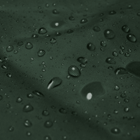 Water droplets on dark green fabric of Men’s Windbreaker Jacket showcasing water resistance