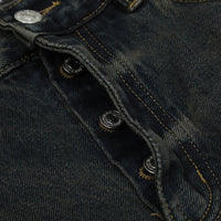 Dark denim jeans with button fly.