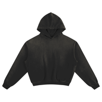Black essential hoodie with vintage wash finish, featuring a relaxed fit and soft fabric.