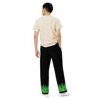 Person wearing black pants with green flames.