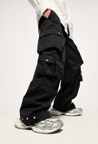 Black cargo pants with silver sneakers.