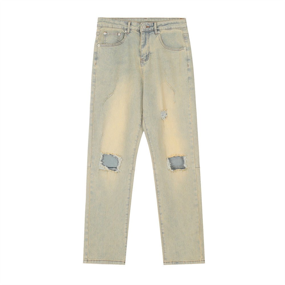 Ripped light wash jeans.