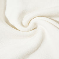 Swirled white fabric of Distressed Streetwear Knit Sweater showcasing softness and style