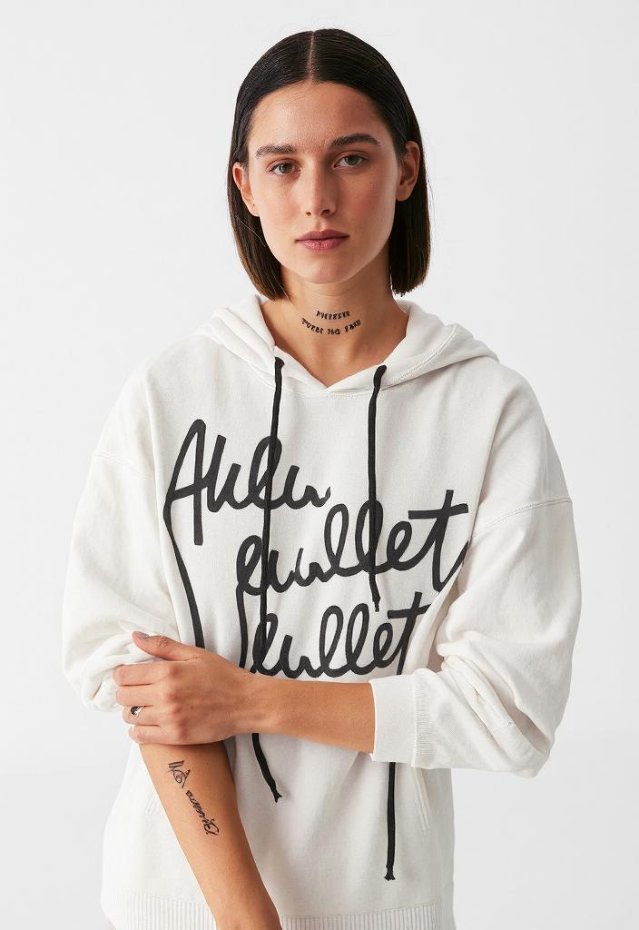 White hoodie featuring black lettering in a Distressed Streetwear Knit Sweater style