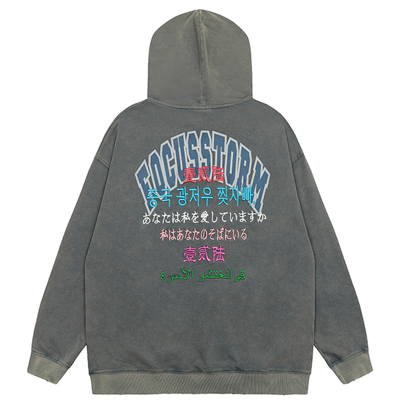 Gray hooded sweatshirt with FOCUSSTORM text in Y2K streetwear style