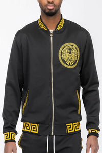 Black and gold lion bomber jacket featuring Greek key design and lion emblem detail