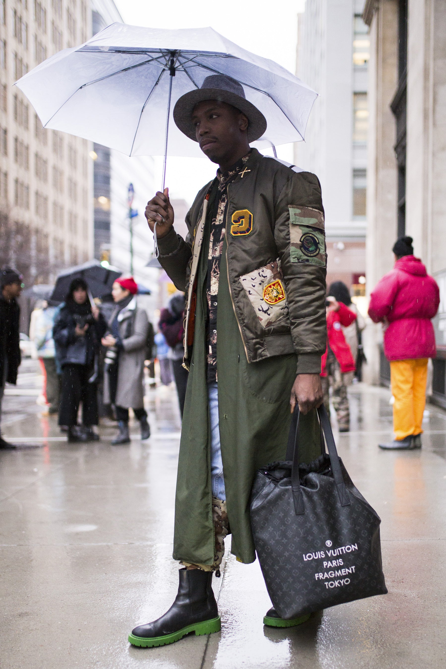 Men showcasing New York streetwear apparel — with Louis Vuitton bag