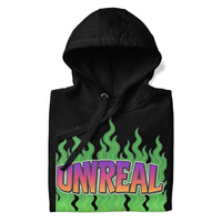 Folded black hoodie with ’Unreal’ graphic.
