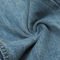Wrinkled blue denim fabric.