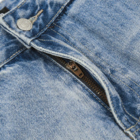 Blue denim jeans with zipper.