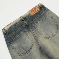 Distressed denim jeans.