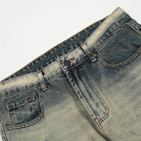 Distressed denim jeans.
