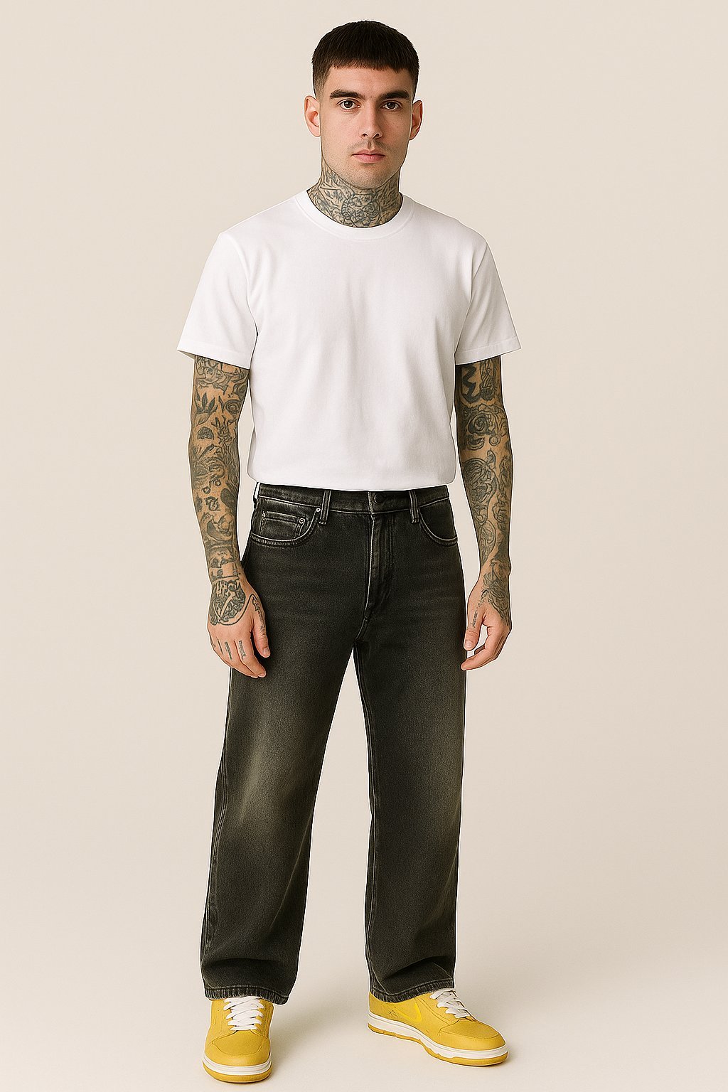 Man in white t-shirt and dark jeans.